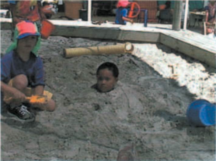 Child buried in sandpit