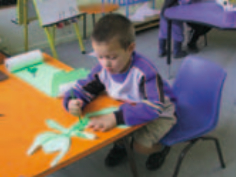 Child creating a cut-out