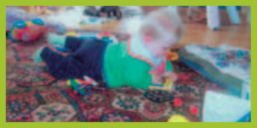 Infant boy lying on stomach