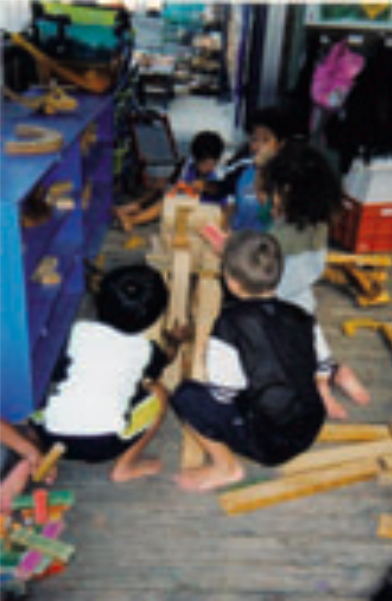 Three children building a project