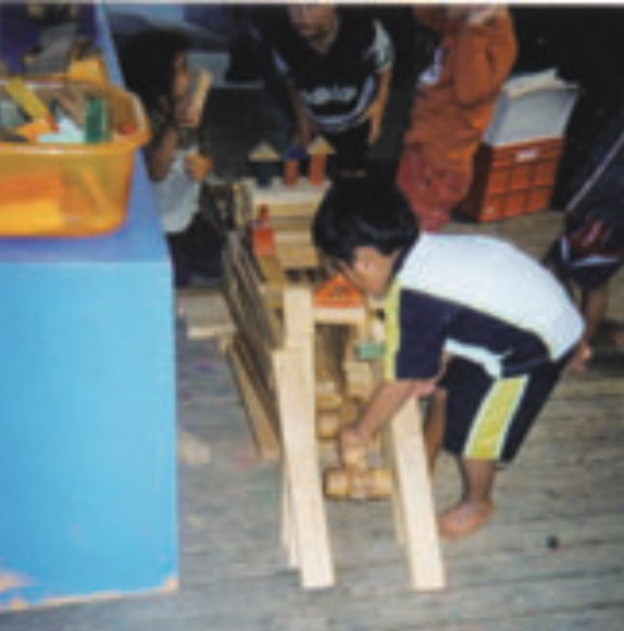 Three children building a project