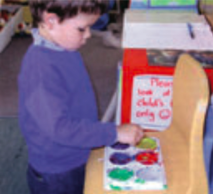 Child mixing paint