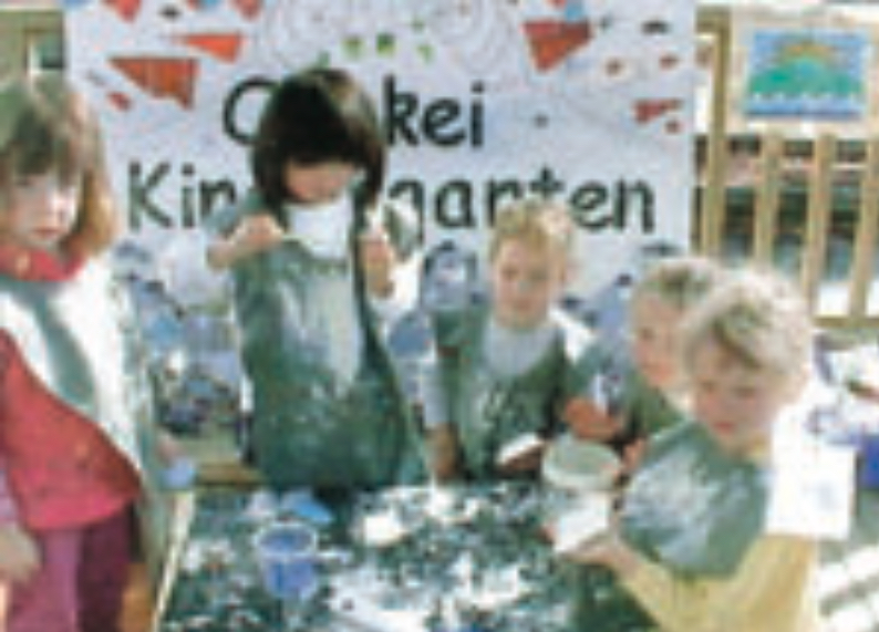 Children creating mosaic