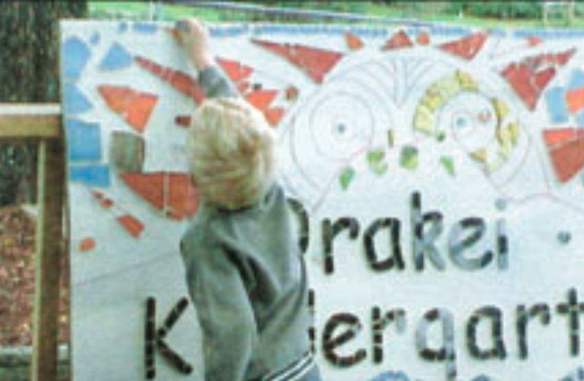 Child in front of mosaic