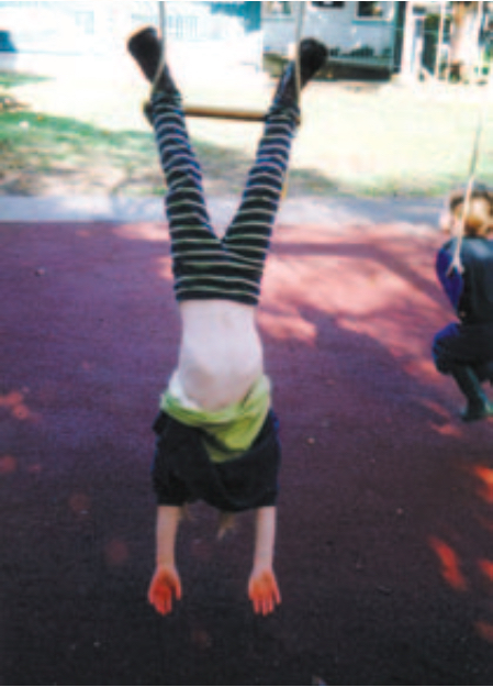 Child doing a hand-stand