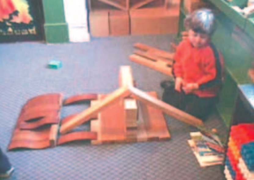 Child building a model house