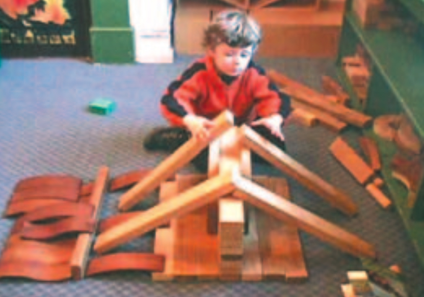 Child building a model house