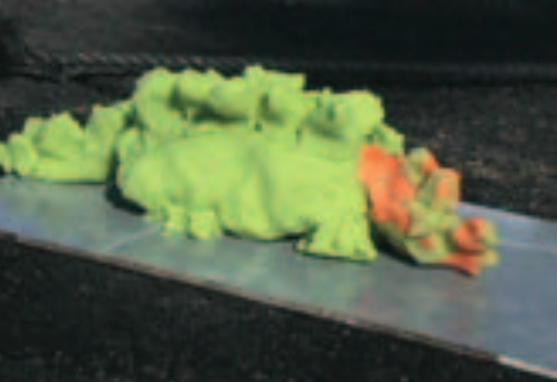 Green play-dough dinosaur