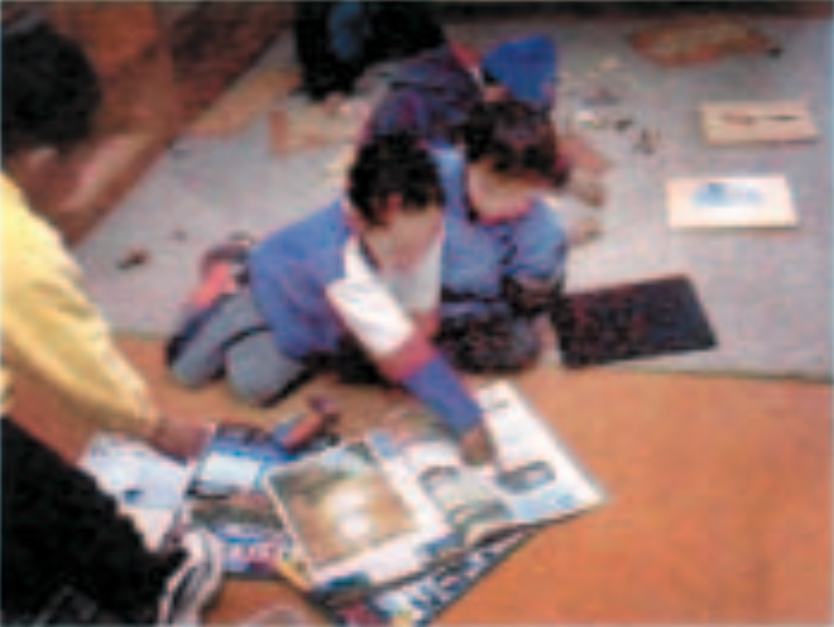 Two children looking at books