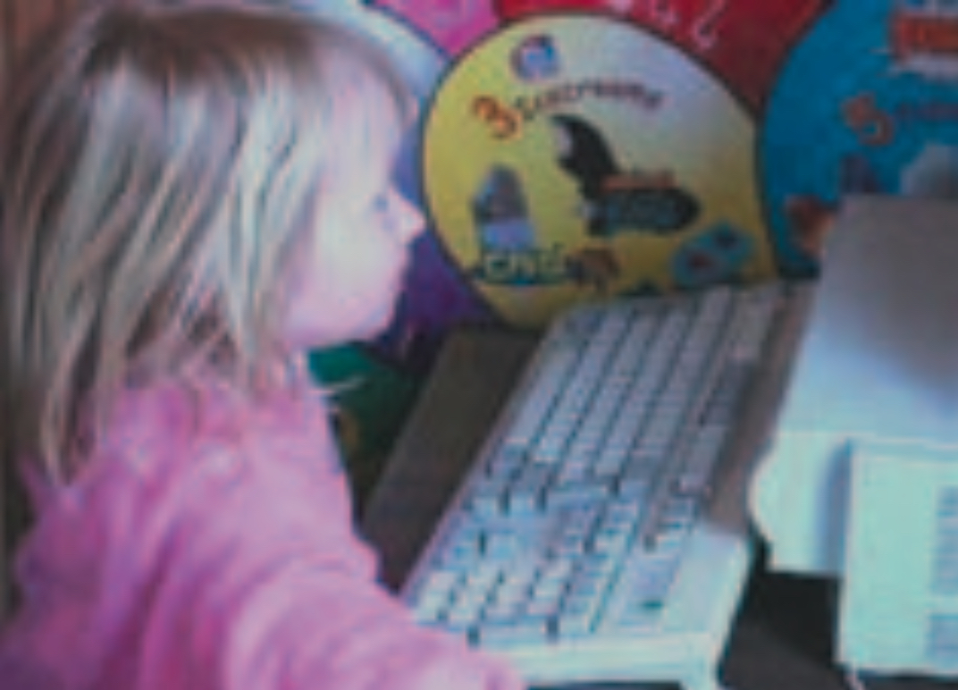 Blond girl using computer keyboard
