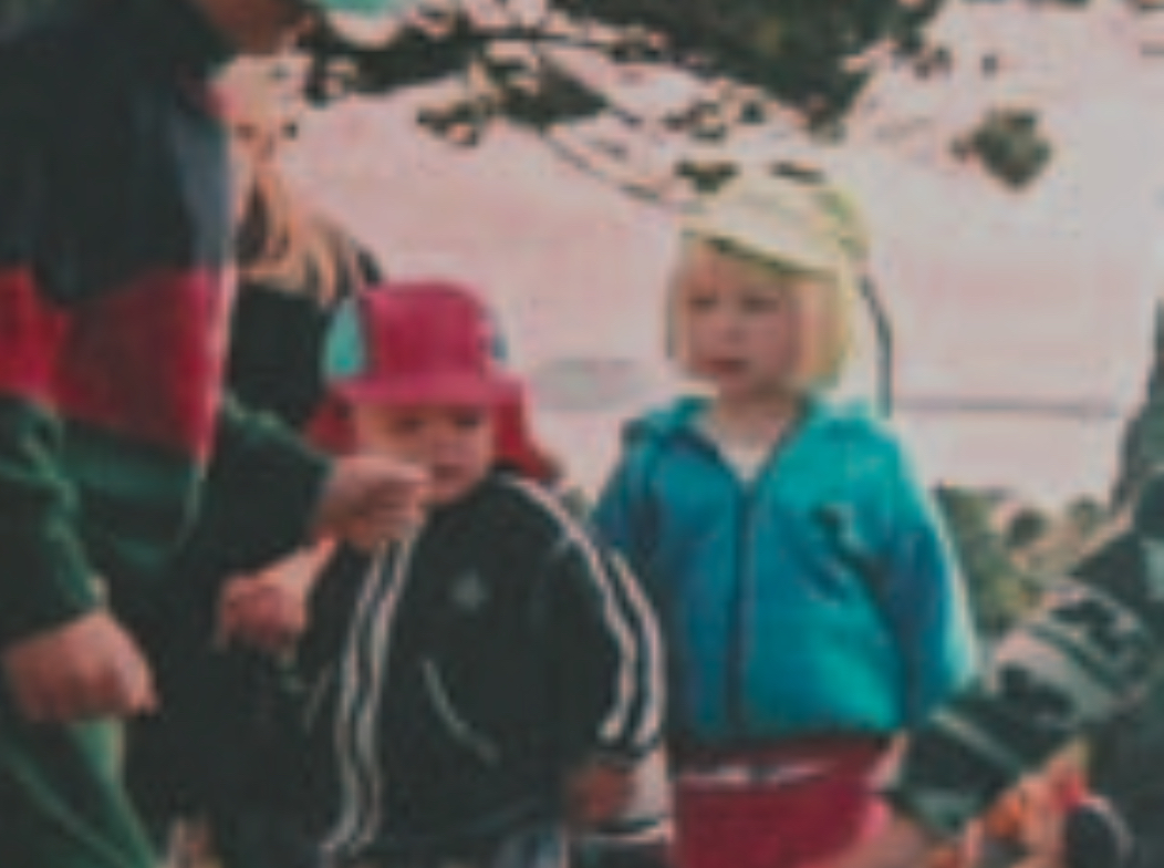Blond girl walking with other children