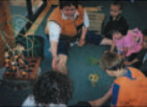 Children gathered around a tamariki