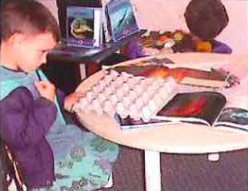 Child working with an egg tray